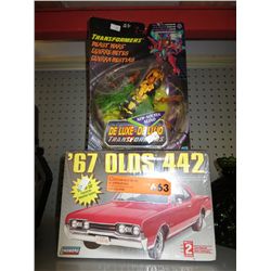 Transformer toy and car model