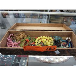 Vintage carved wooden box containing beads