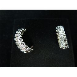 Sterling silver diamond half hoop earrings.