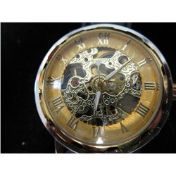 Man's wind-up skeleton watch. 2-sided