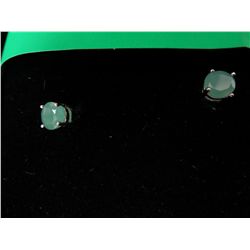Emerald stud earrings set in sterling silver