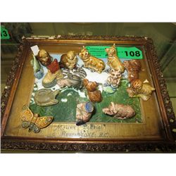 15 Wade figurines on a vintage picture frame
