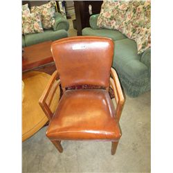 Vintage upholstered wood armed chair