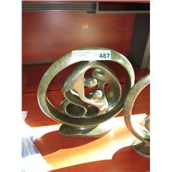 Carved soapstone family circle statue