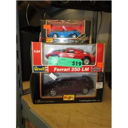 Three scale model cars