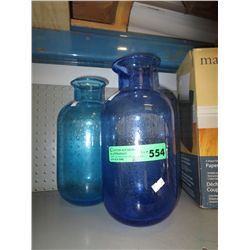 2 blue glass vases 6" dia.