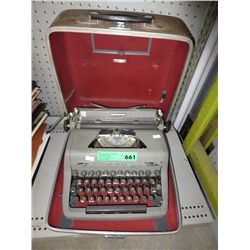 Vintage portable manual typewriter with case