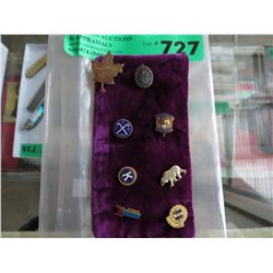 Eight vintage pins