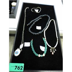 Tray containing five pieces of jewelry