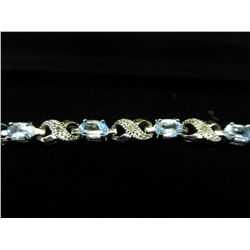 6. carat oval cut blue topaz tennis bracelet