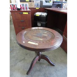 Antique tripod leg table. Heavily carved.