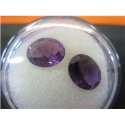 Two loose 2.5 carat cut amethyst gemstones