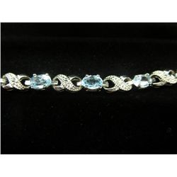 Ladies blue topaz & diamond tennis bracelet