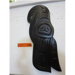 Hand carved native raven, left facing