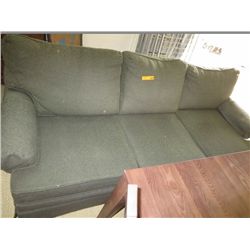 Green upholstered sofa , used