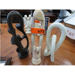 Four carved stone statue