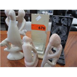Six carved stone statues