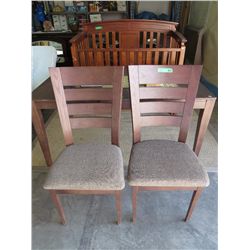 2 wooden dining chairs with upholstered seats