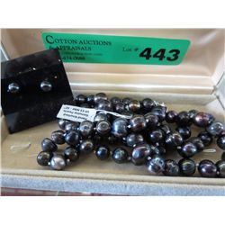 32" strand of hand knotted blackish pearls 10ml