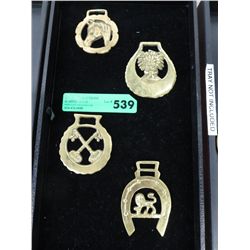 Four horse brasses