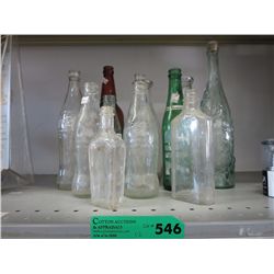 12 glass bottles, some vintage