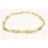 Image 1 : 10kt Yellow Gold and Genuine Peridot Bracelet