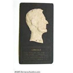 Lincoln Macerated Bust. This 3 1/2" high Lincoln bust is mounted to a 6 1/2" black card with gold le