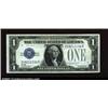 Image 1 : Fr. 1603 $1 1928C Silver Certificate. About Uncirculated.The first of five consecutive 1928C Silvers