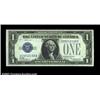Image 1 : Fr. 1603 $1 1928C Silver Certificate. About Uncirculated.The middle note in the run, and a particula