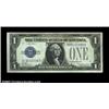 Image 1 : Fr. 1603 $1 1928C Silver Certificate. About Uncirculated.Nice, but with a slight finger smudge at th