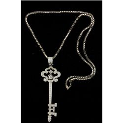 PENDANT: Unisex 14kw skeleton key motif diamond pendant; 1 rb dia, 4.8mm = est 0.40ct, V.Good/G-H/SI