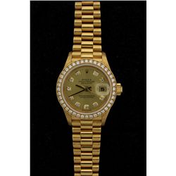ROLEX: Ladys 18ky Rolex O.P. Datejust diamond wristwatch; 26.1mm case; champagne dial w/ 10 rd dias,