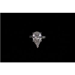 RING:  [1] Platinum ring set with a pear shaped HTHP diamond, 13.49 x 8.37 x 4.52mms = 3.13cts., E,