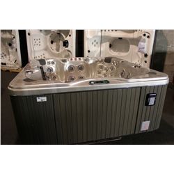 CAL SPAS COLEMAN SERIES HOT TUB WITH OYSTER OPAL INTERIOR AND 7' LIGHT GREY CABINET. C/W: