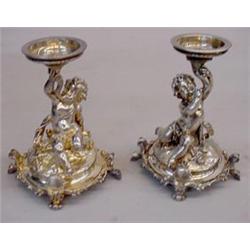 PAIR OF SILVER PLATED FIGURAL CANDLESTICKS