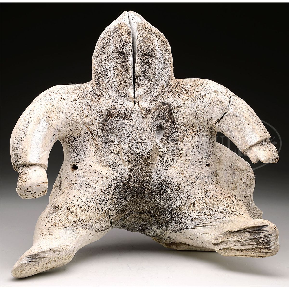 LARGE WHALE BONE CARVED INUIT FIGURE WITH DOG.