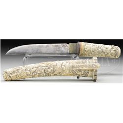 JAPANESE DAGGER WITH CARVED SCABBARD.