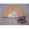 Image 1 : TWO PIECES: Pictured is an engraved mother-of-pearl fan with ecru silk embroidery and silver sequins
