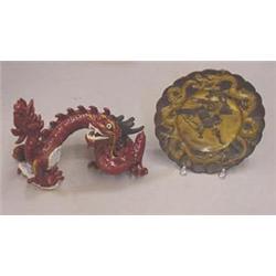 TWO ORIENTAL PIECES: Pottery dragon with red glaze
