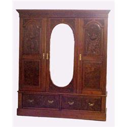 ORNATELY CARVED BREAKDOWN ARMOIRE