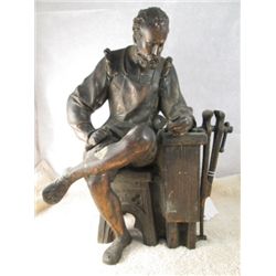 CAST SPELTER FIGURINE OF A CARPENTER