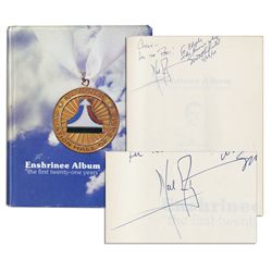 Neil Armstrong Signs a Book on ''The National Aviation Hall of Fame'' -- Into Which He Was Enshrined