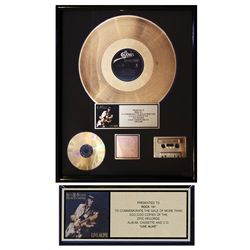 Stevie Ray Vaughan and Double Trouble Gold RIAA Award for ''Live Alive''