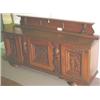 Image 1 : THREE DOOR CARVED OAK RENAISSANCE REVIVAL STYLE BUFFET, first  quarter 20th century, having a car…
