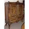 Image 1 : FINELY CARVED ROCOCO STYLE WALNUT TWO-DOOR CABINET, first-quarter  20th century, having a foliate…