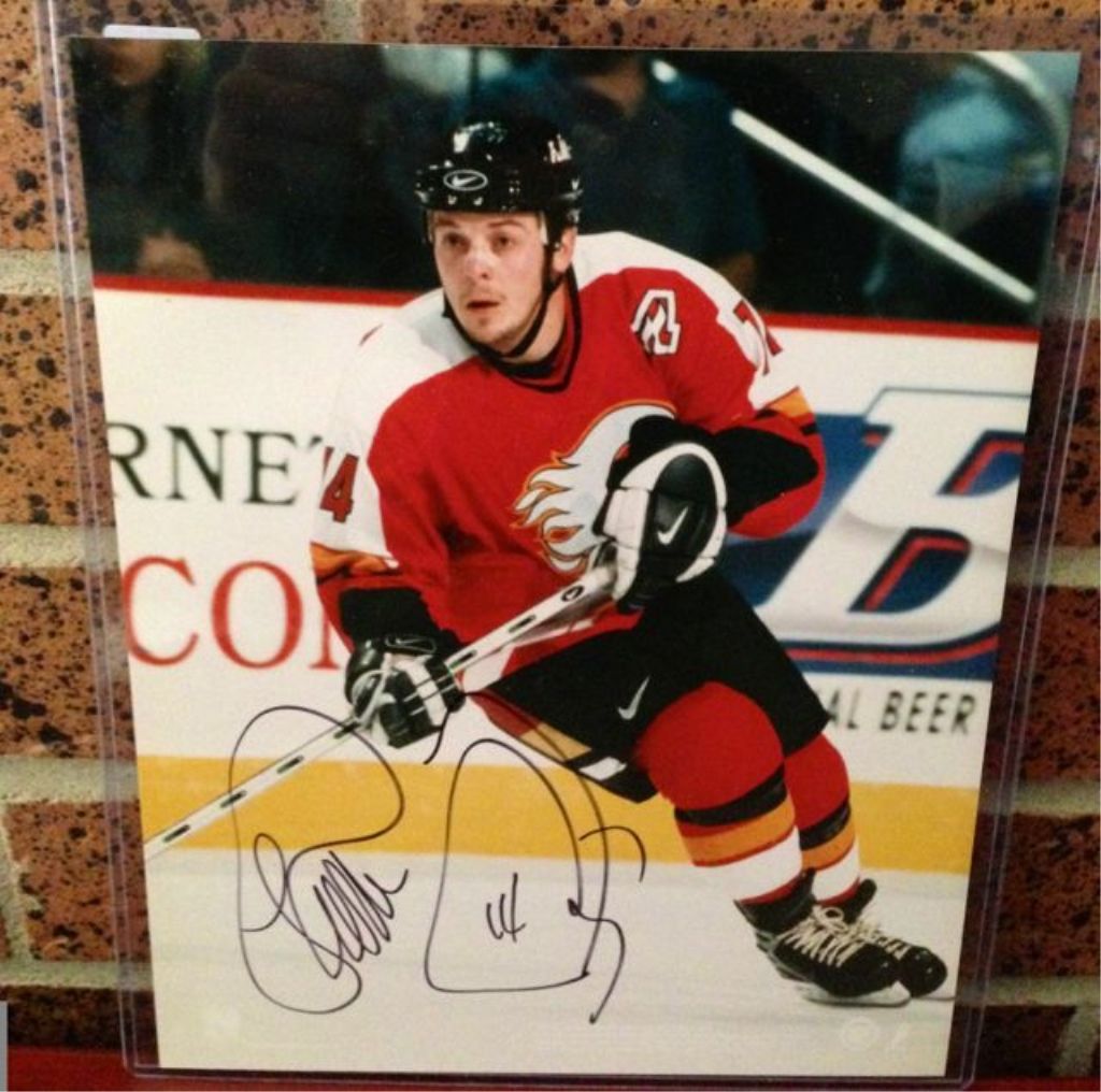 Theoren Fleury 8 x 10 action photo signed.