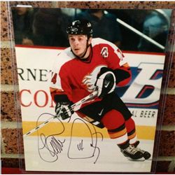 Theoren Fleury 8 x 10 action photo signed.