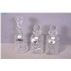 Image 1 : Three pinwheel crystal decanters with stoppers and silverplate drinks labels