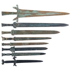 Eight Assorted Engraved Edged Weapons