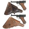 Image 1 : Two DWM Luger Semi-Automatic Pistols with Holsters and Extra Magazines -A) 1918 Dated Luger Pistol